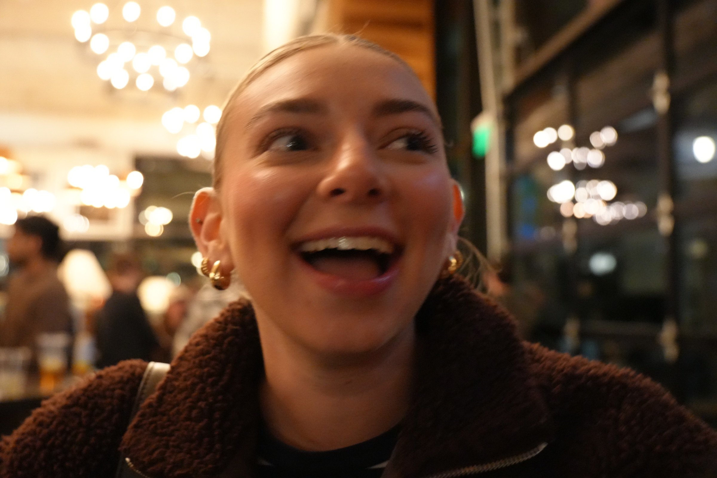 Close portrait in a warmly lit restaurant